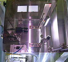 A camera checks for foreign substances on the initial material and inspects the product dimensions at high speed.